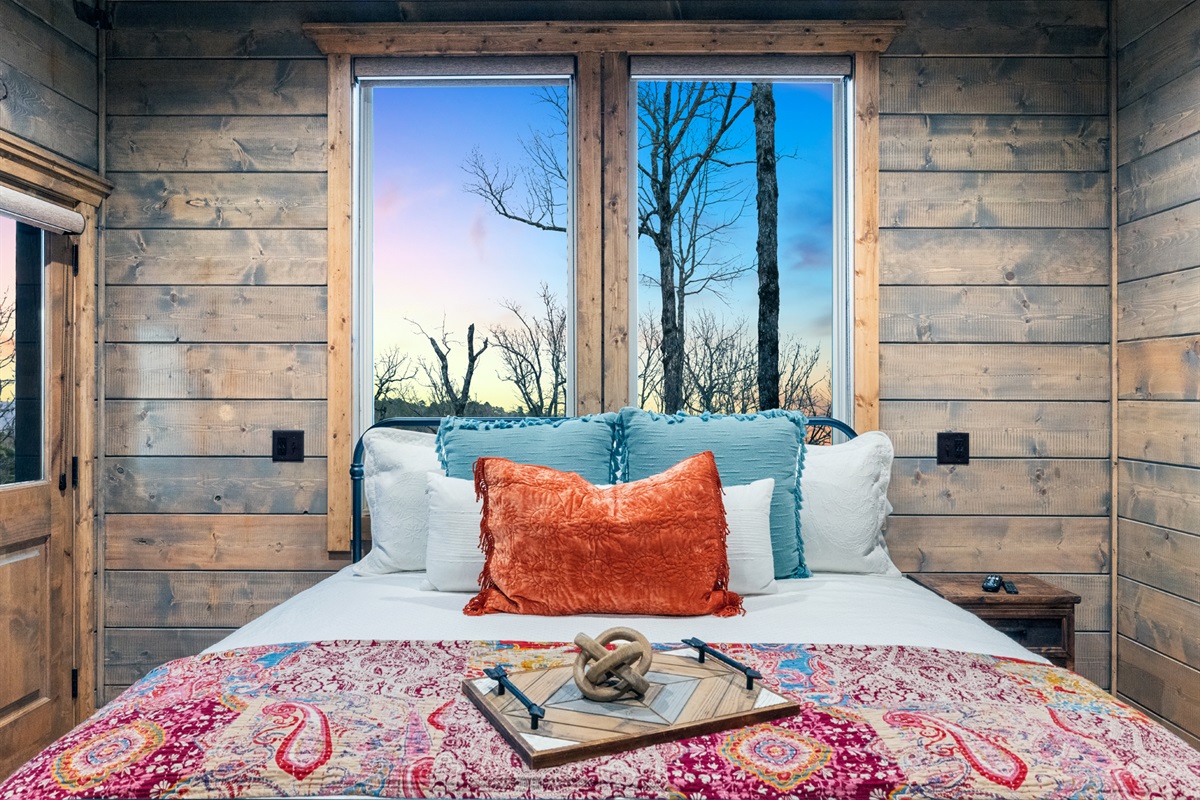 Cozy rustic bedroom with warm wood interiors and peaceful natural light