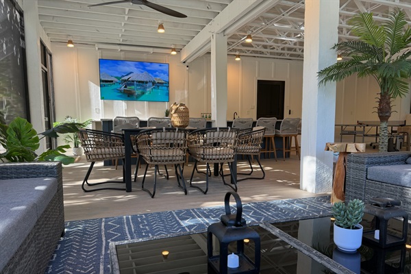 The ultimate massive screened-in lower level lounge area-85" UHD smart TV