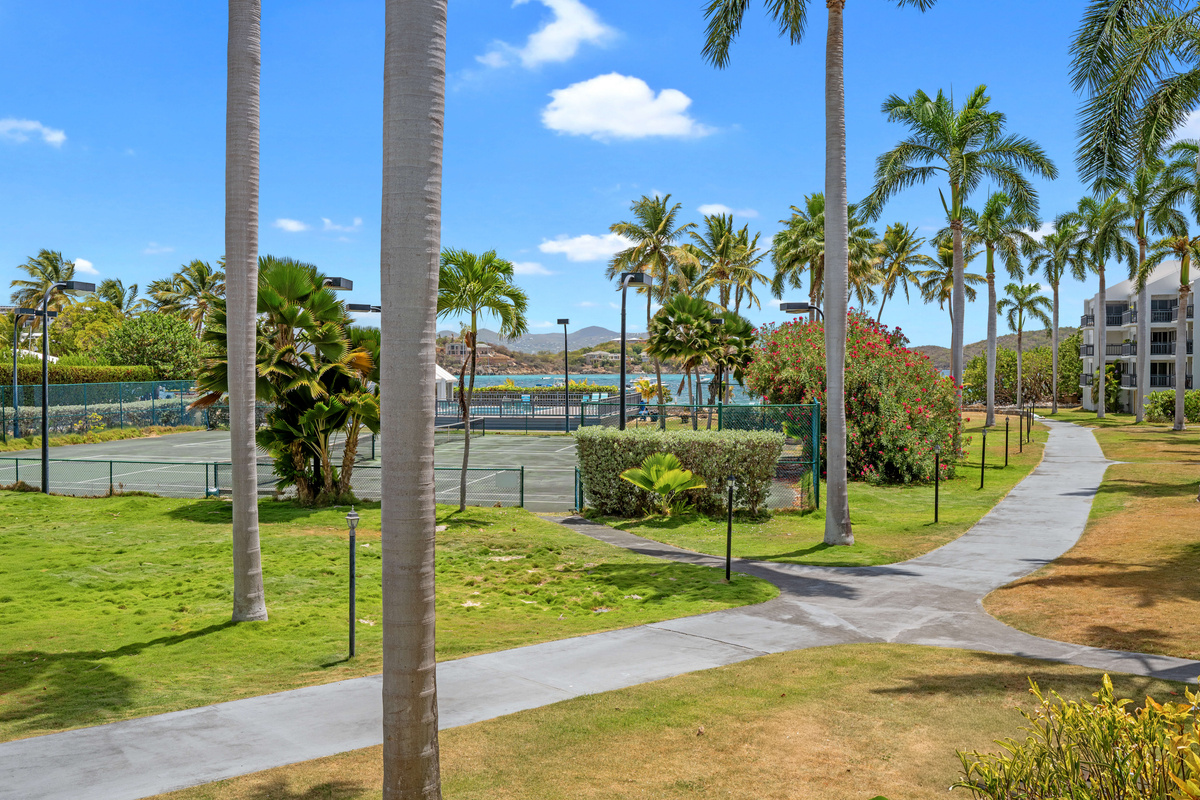 Stroll through the beautifully maintained tropical resort grounds.