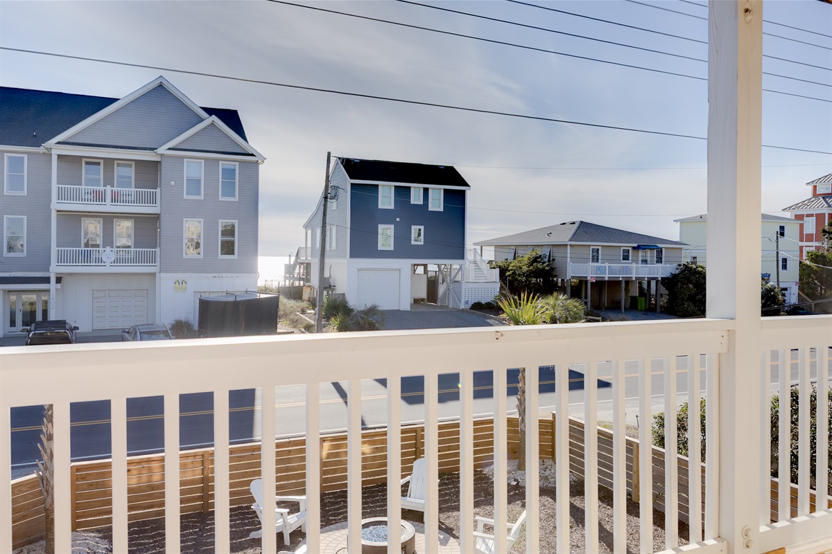 Relax on the balcony with ocean views in the distance