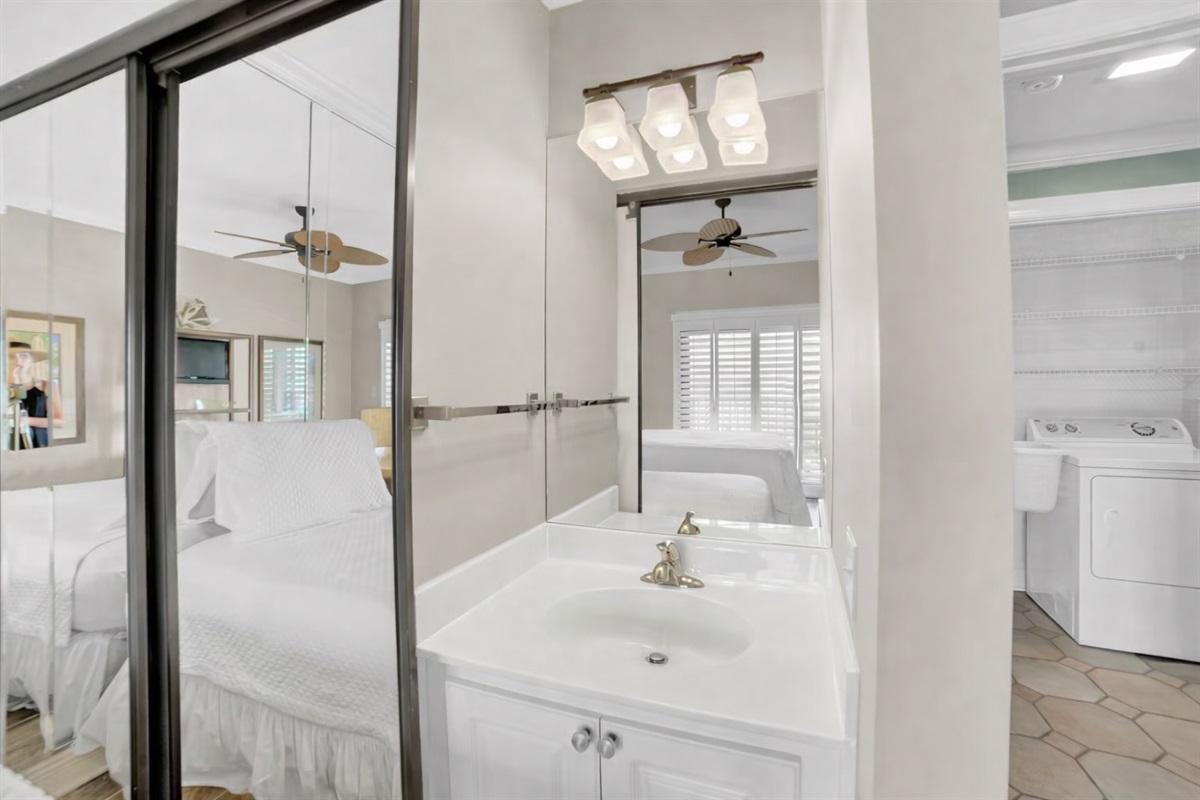 Guest bedroom will accommodate 3 guests. I will be removing the mirror wall, putting a new fan with light kit in, wall mounting a smart tv and a vanity. 