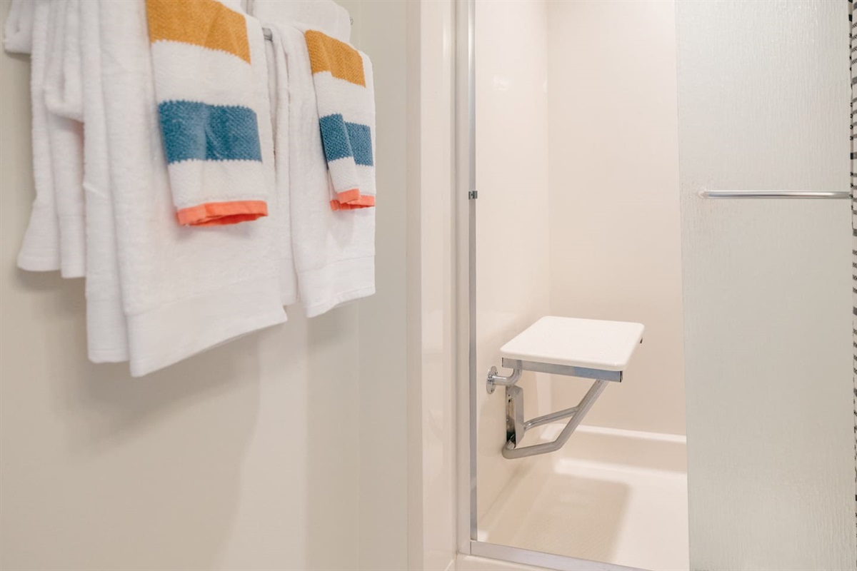 Shower seat can be put down for use or folded up if not needed. 