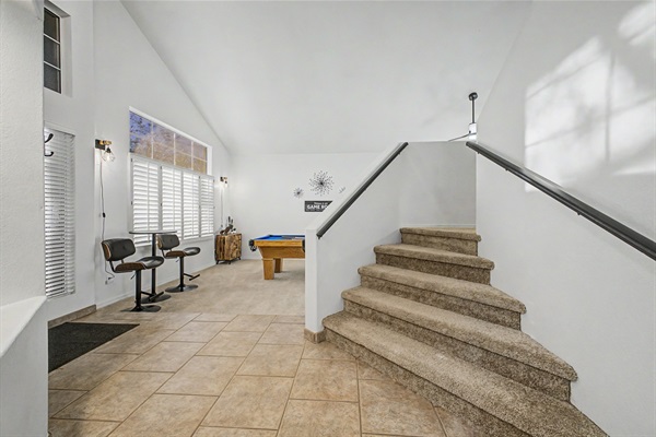 Game Room: Play, relax, and unwind in this sunlit space with a pool table, board games and stylish seating!
