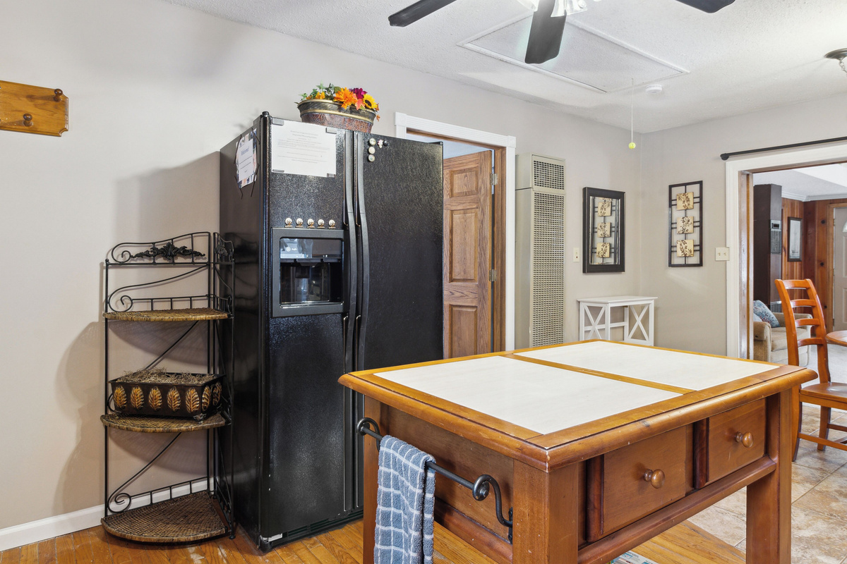 Island for food prep and large fridge with ice maker! (Dispenser out of order)