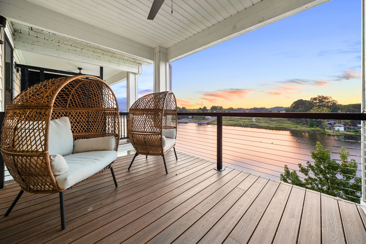 Relax in stylish hanging chairs overlooking the water&mdash;your private retreat by the lake.