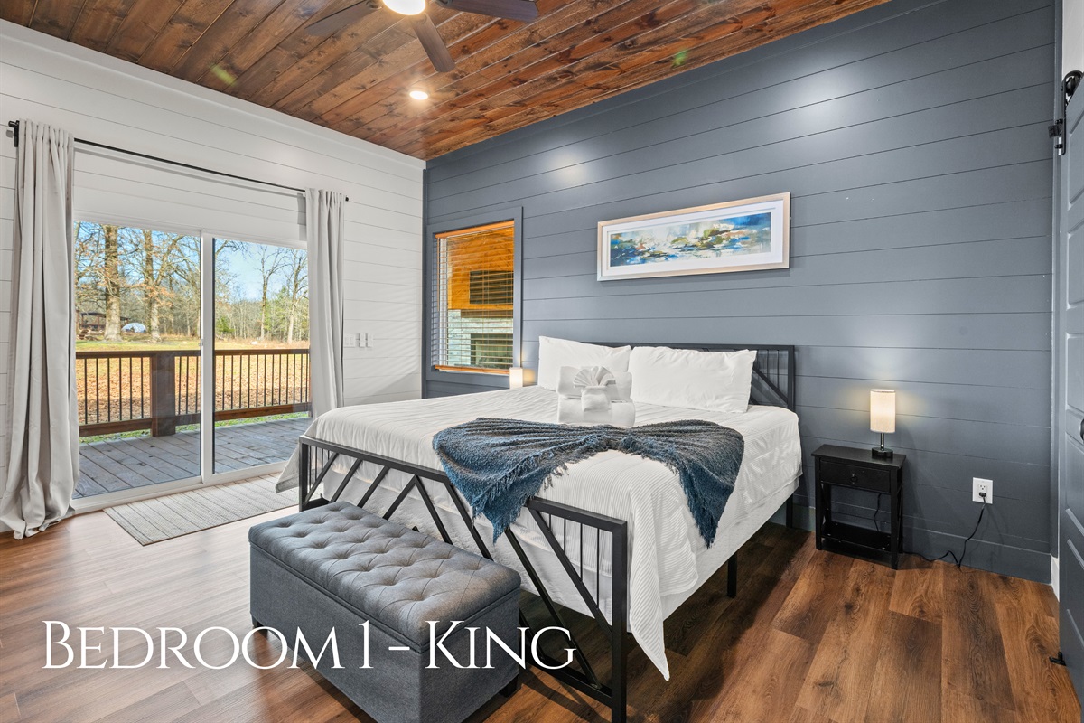 Rest comes easy in this cozy king bedroom, featuring a comfortable bed and a relaxing atmosphere that feels calm and inviting.