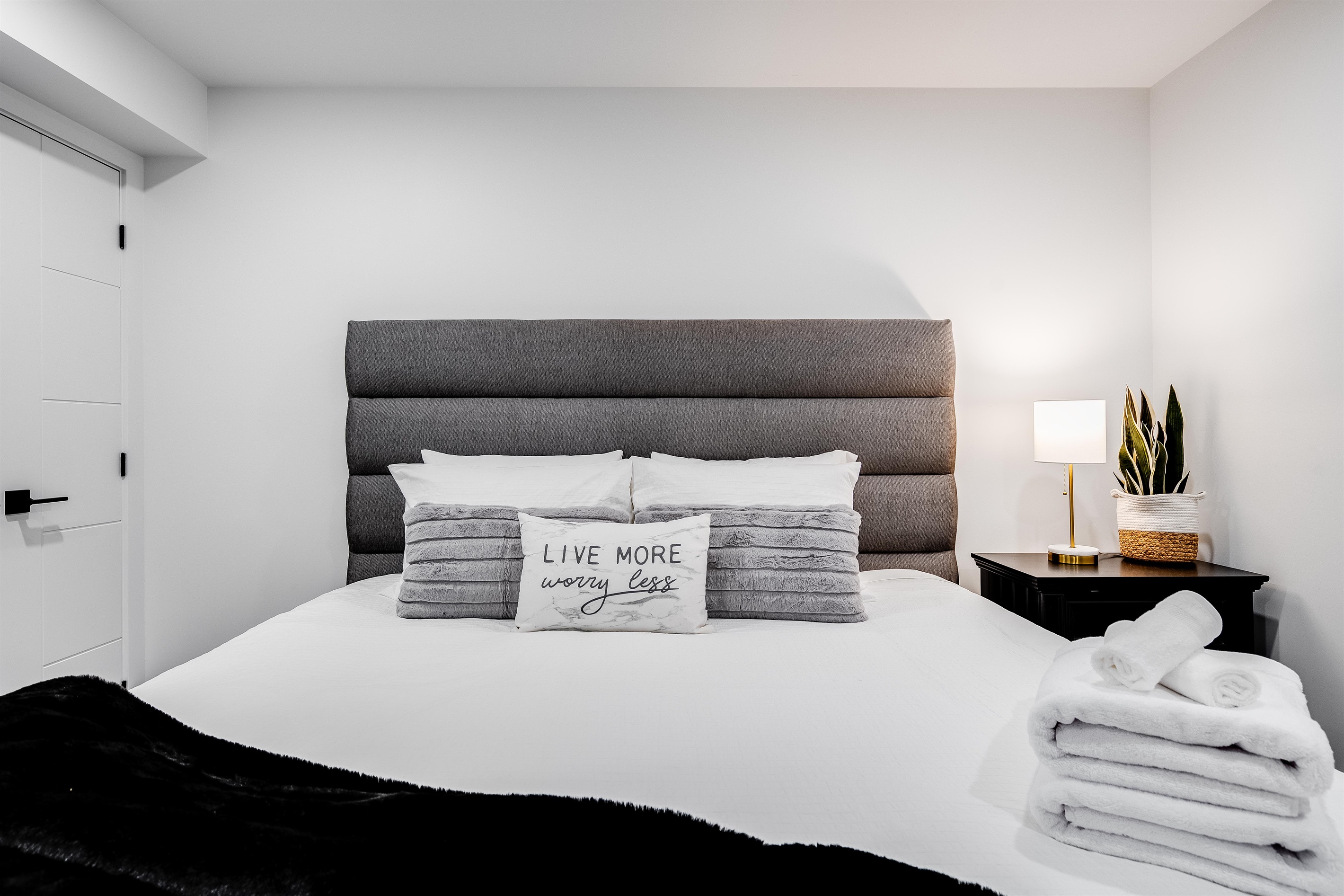 King Bedroom with Natural light highlights the modern design.
