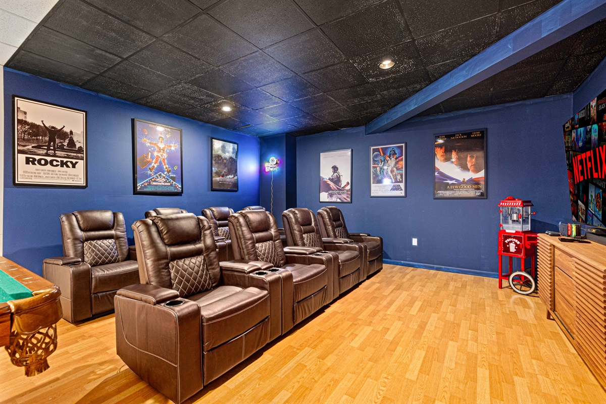 Home Theater: Experience movie magic in plush recliners with classic film posters and fun decor!