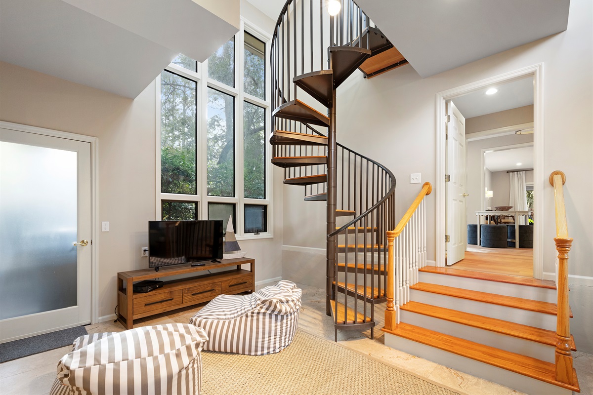 Kid's den features and Xbox and spiral staircase up to Double Queen bedroom over the garage