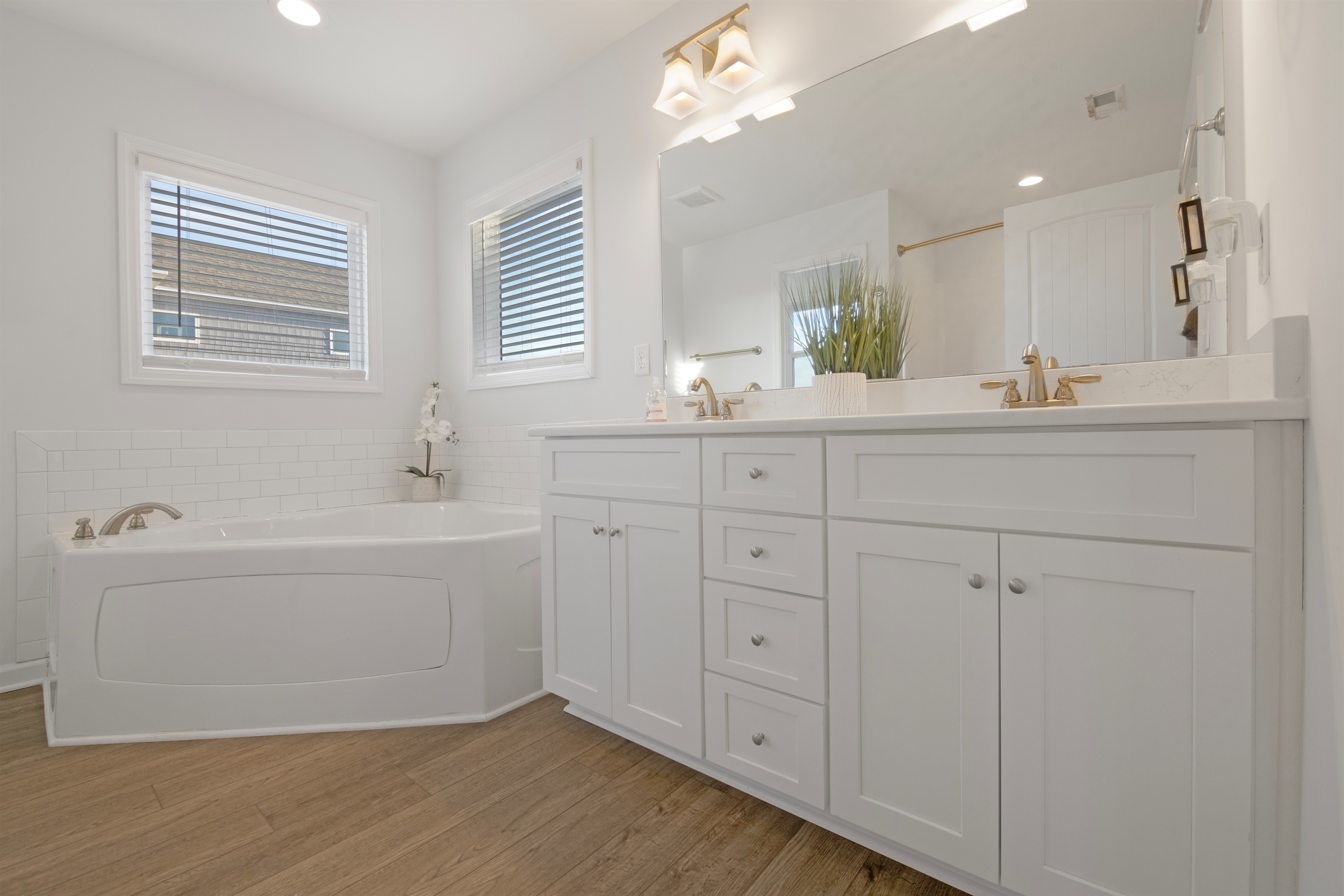 Refresh after beach days in the primary ensuite bath - offering both a soaker tub and shower.