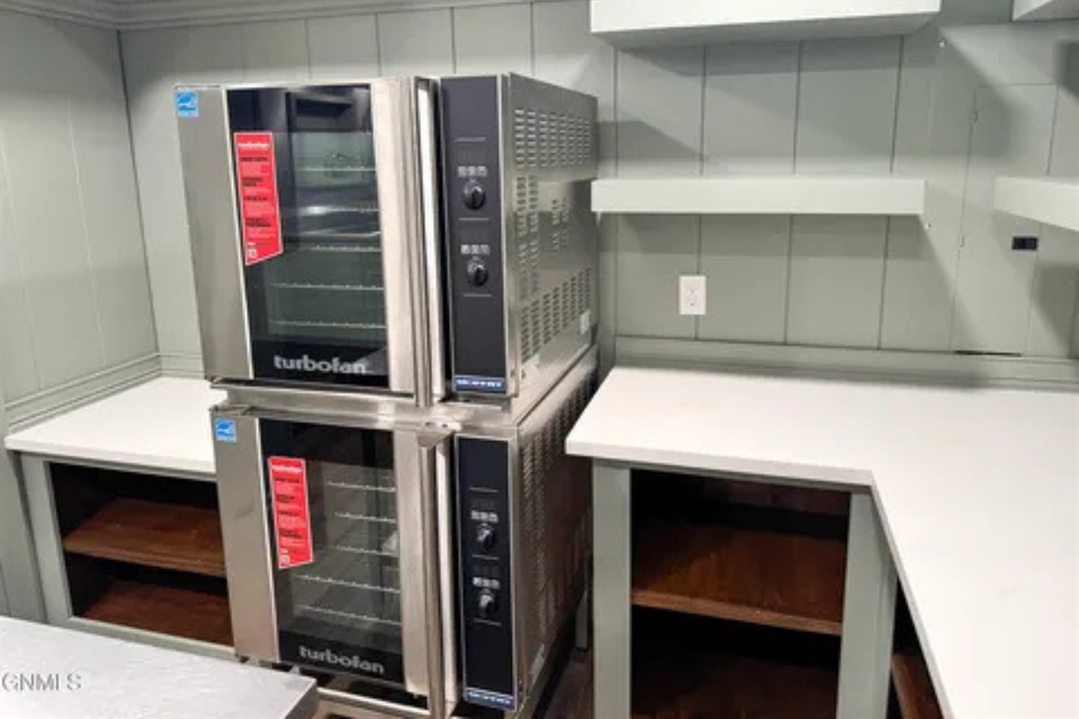 Double ovens and added counter space make group cooking much easier here.