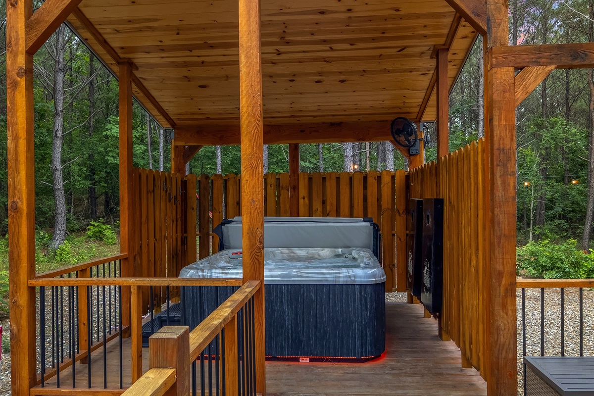 Hot tub nook with privacy walls off set from the outdoor living area.