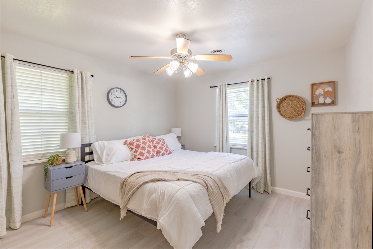 Your getaway starts here: master suite featuring a cozy king bed.