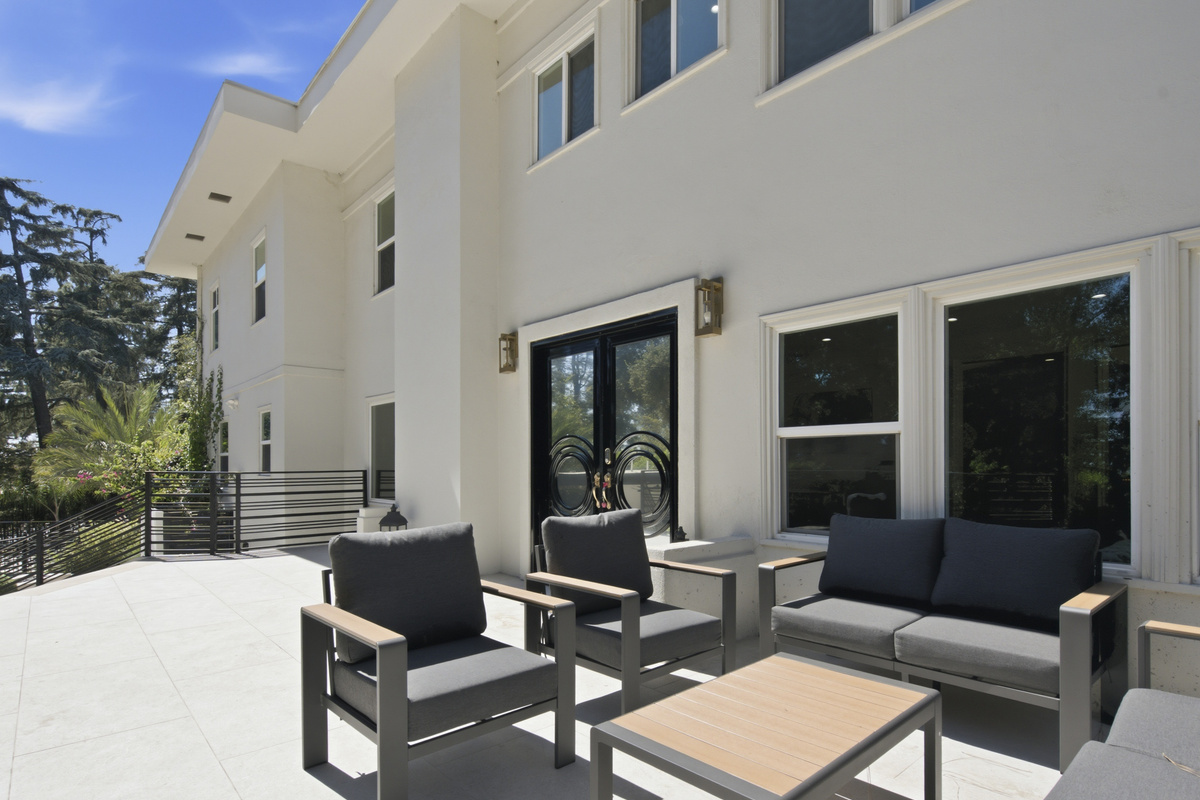 This expansive outdoor space is designed for sunny pool days, friendly competition, and quality time together.