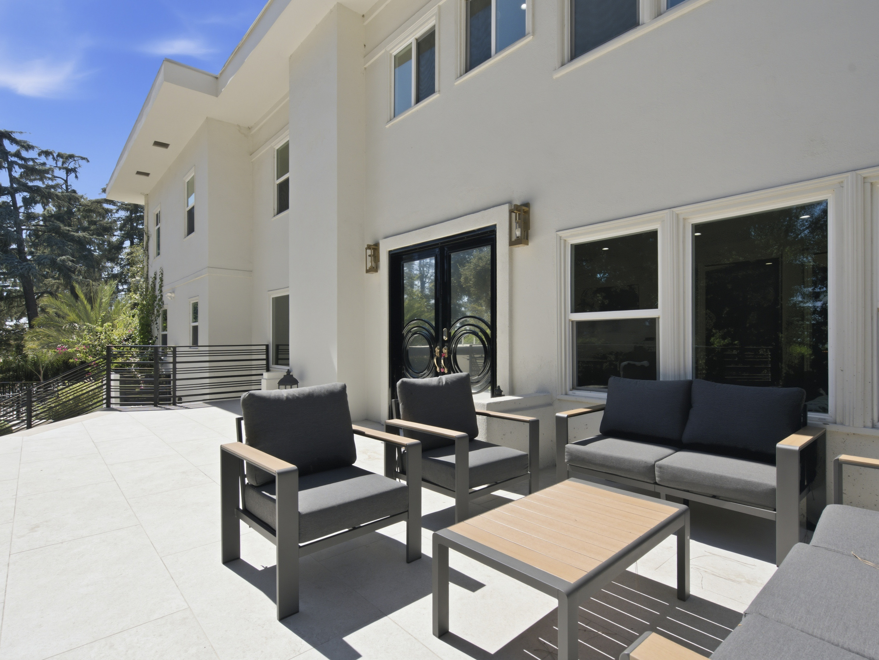 This expansive outdoor space is designed for sunny pool days, friendly competition, and quality time together.