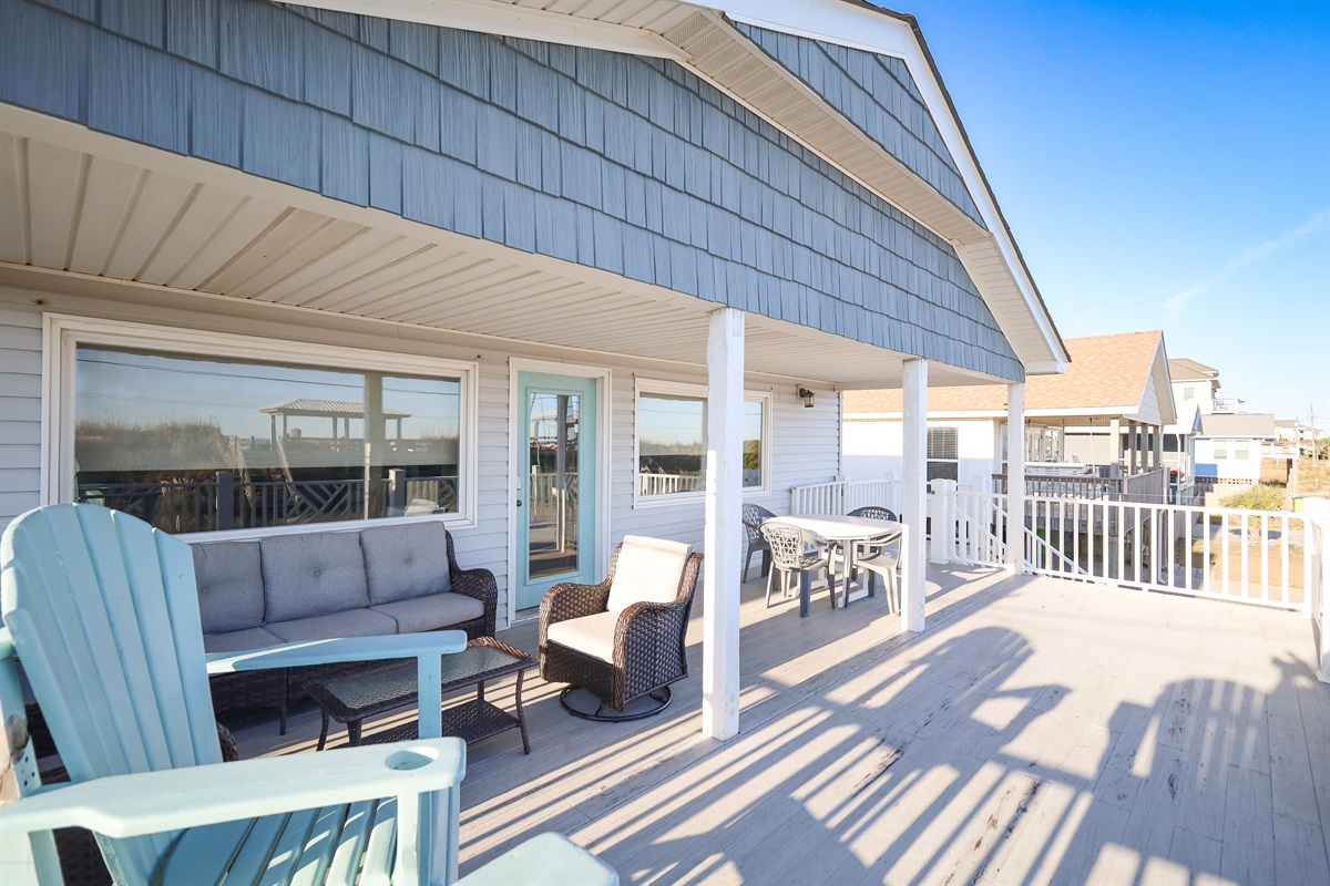 Wide, shaded porch perfect for unwinding after a beach day
