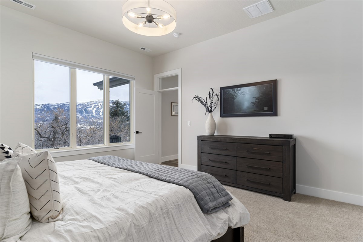 Another view of the primary suite, offering plenty of space and natural light.