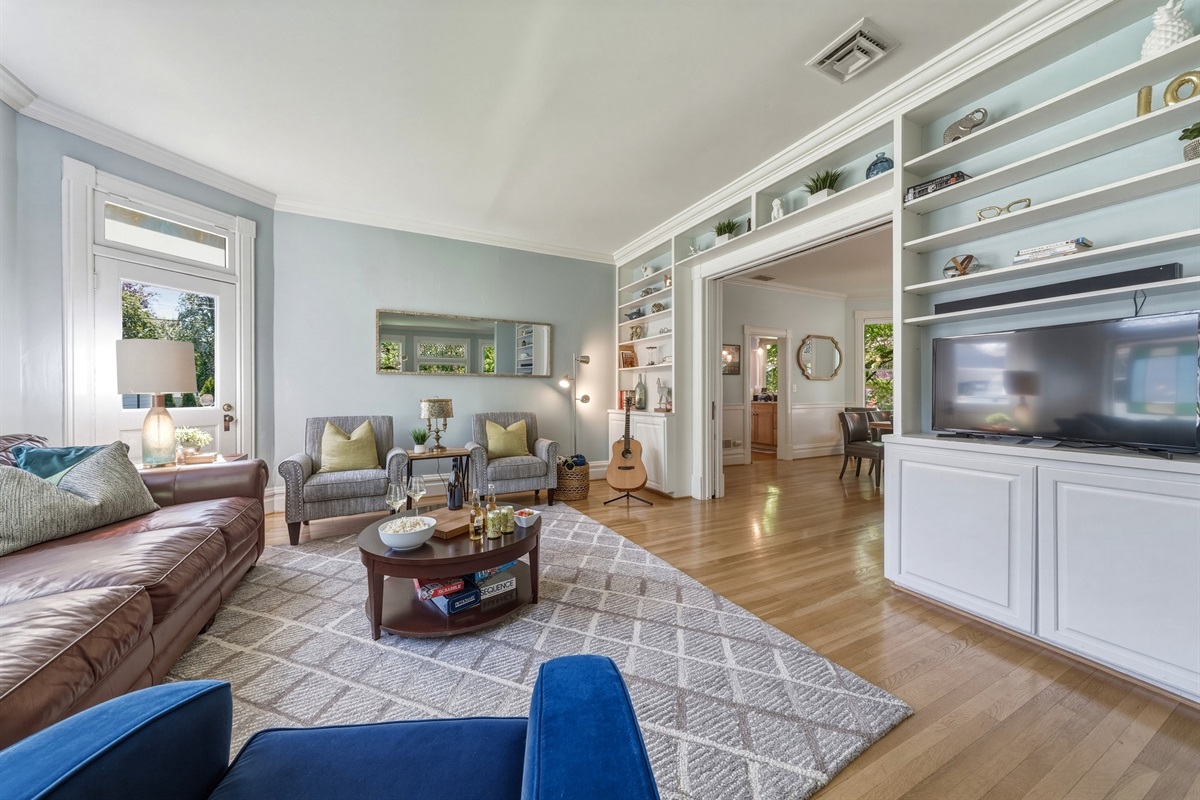 TV room with Smart TV, lounge seating, & kids games