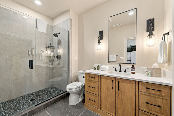 Ensuite bathroom #4 with plenty of storage and a large walk-in closet