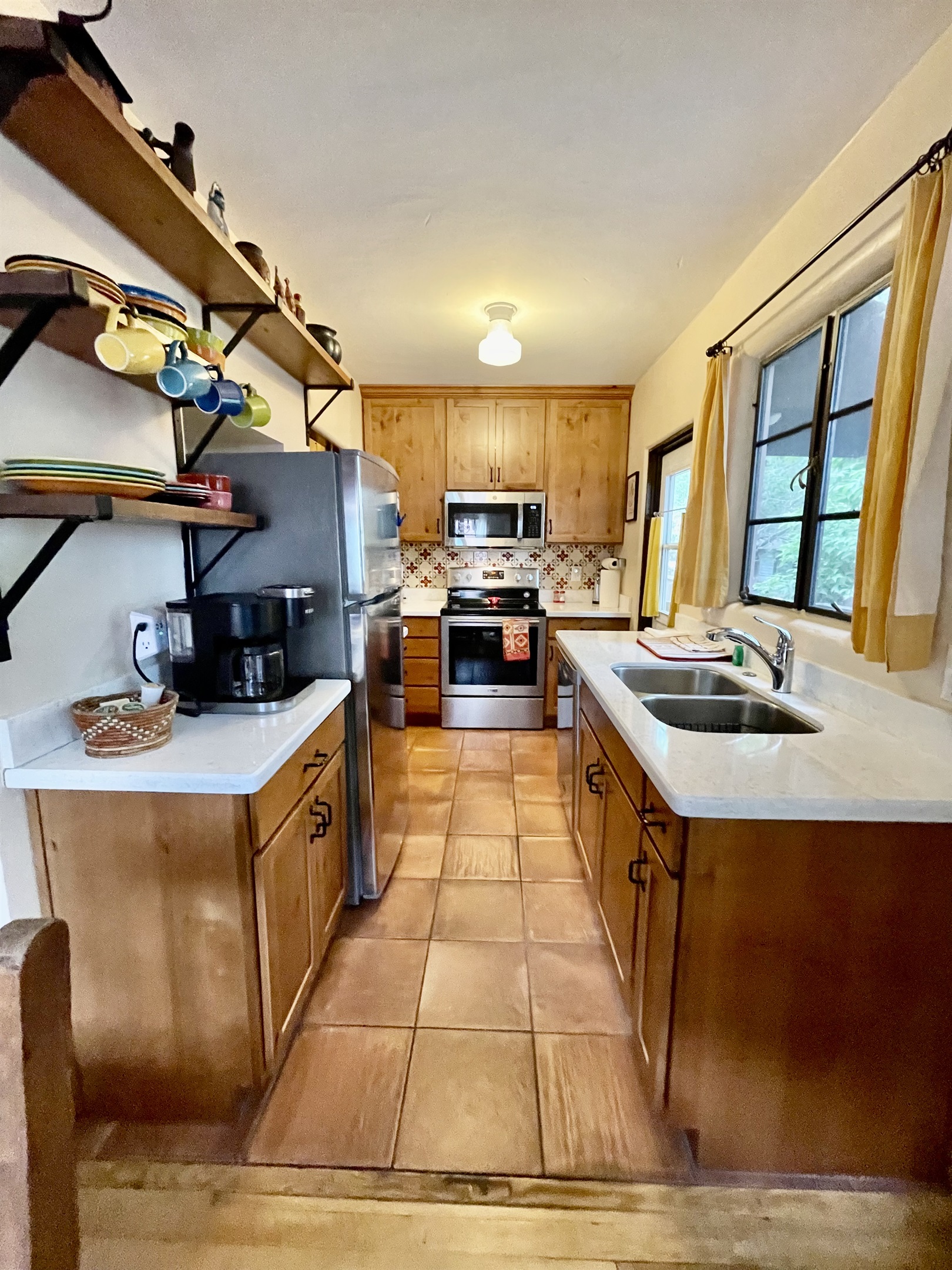 Cooking is a breeze in this fully equipped kitchen, featuring modern appliances and ample counter space.