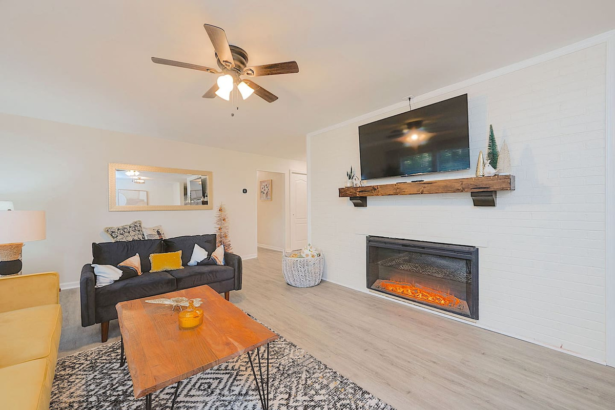 Cozy living room complete with a smart TV and fireplace!