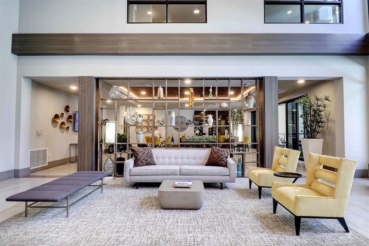 - Relax in a bright and open lobby with elegant furniture and chic decor   - Ideal for meeting friends, reading, or enjoying quiet morning moments   - Modern accents and inviting atmosphere create a welcoming first impression