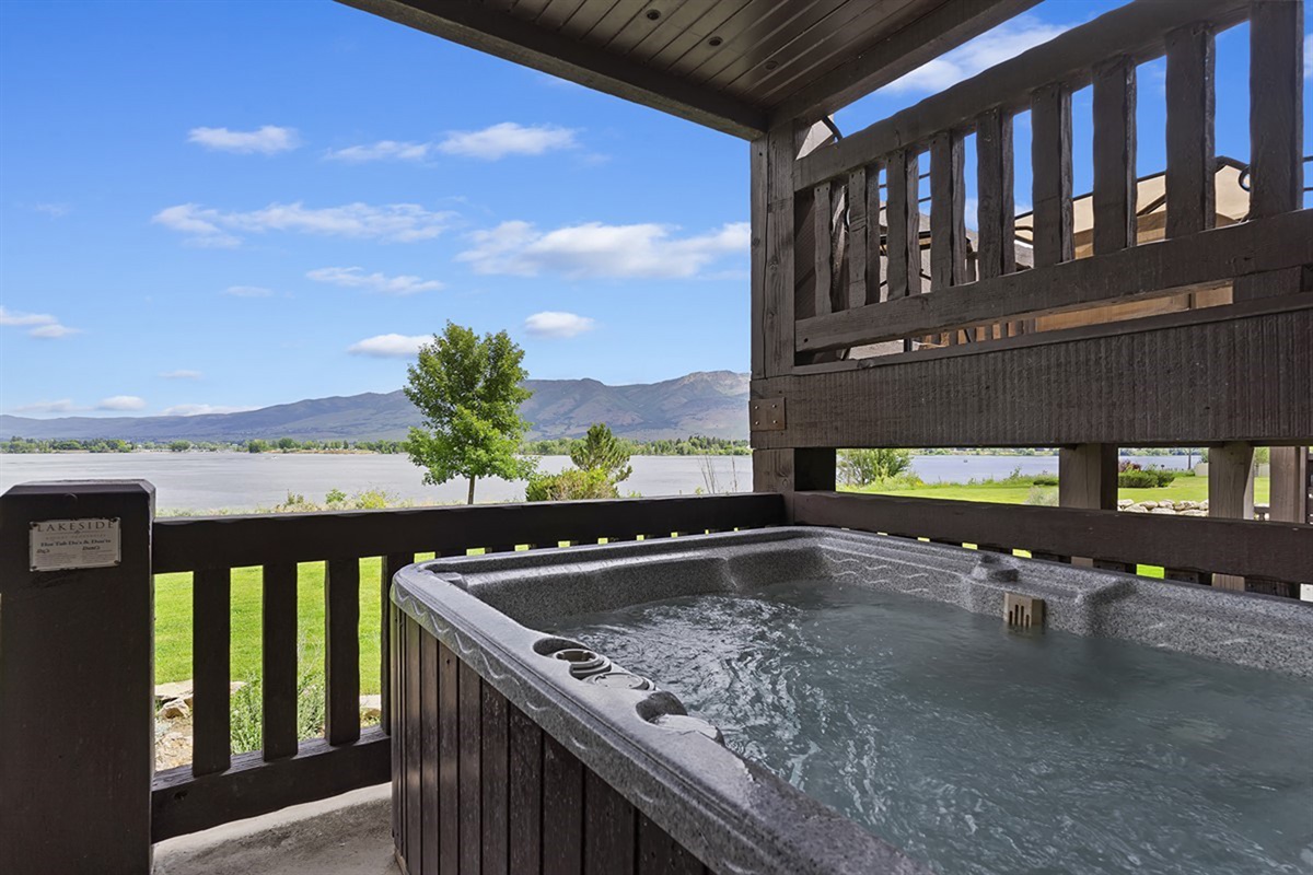 Relax in the hot tub while taking in breathtaking waterfront scenery.
