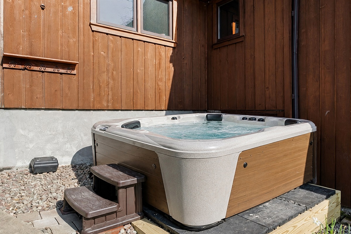 Fire Pit / Hot Tub (alongside the main house) - Unwind in our outdoor hot tub, perfect for relaxing after a day of exploring nearby attractions. Ideal for a soothing retreat. 