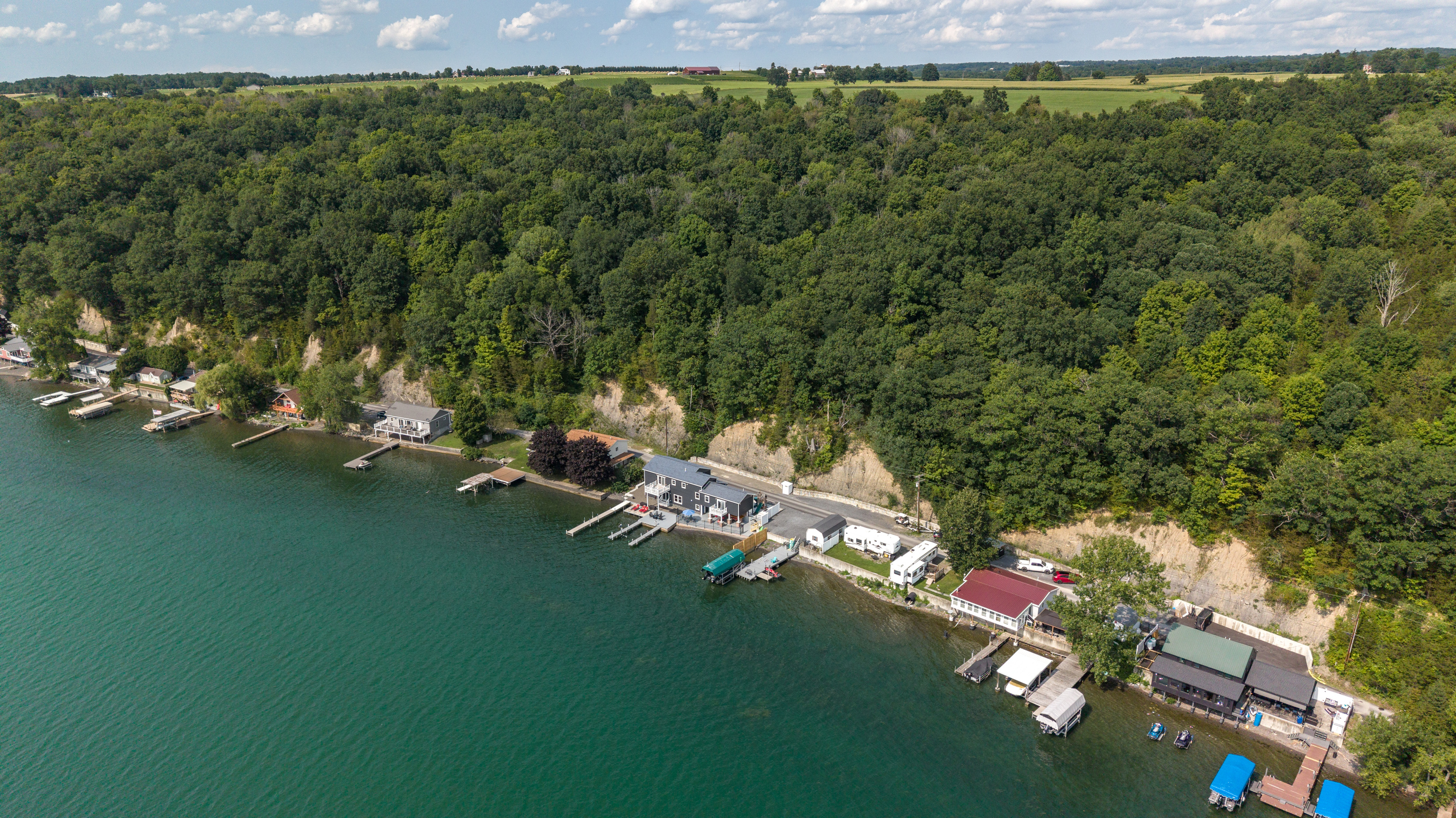 Lakefront homes bordered by dense forest