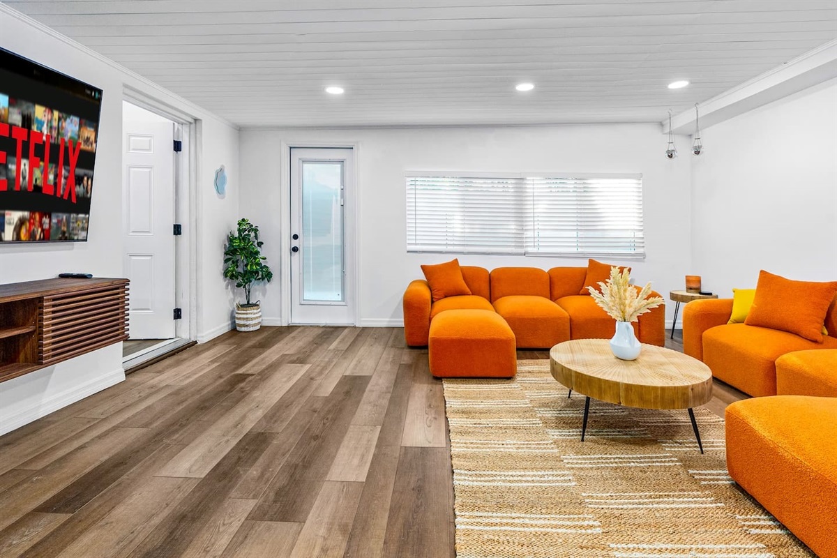 Retro living room with 75-inch LED TV.