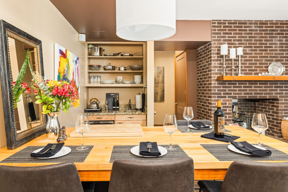 Dining Island seats 4-5 (ask for 5th stool) and doubles as a prep counter for the fully-stocked Kitchenette. Two undercounter refrigerator/freezers, located below island make meal prep easy.