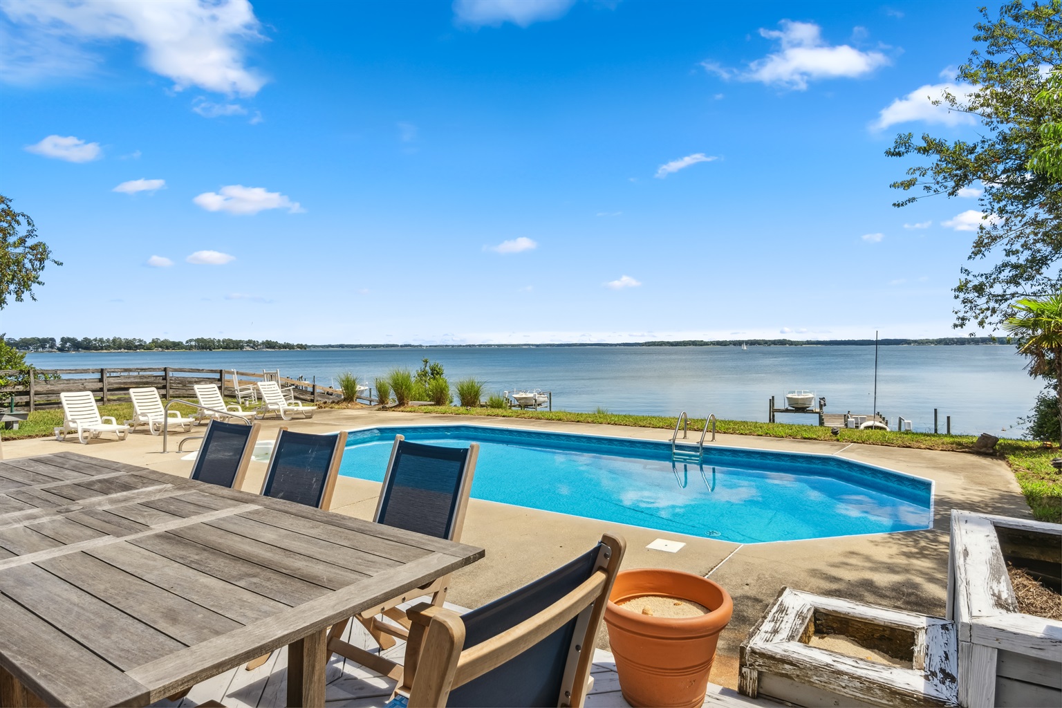 Waterfront outdoor seating with a private pool perfect for relaxed meals and swims.