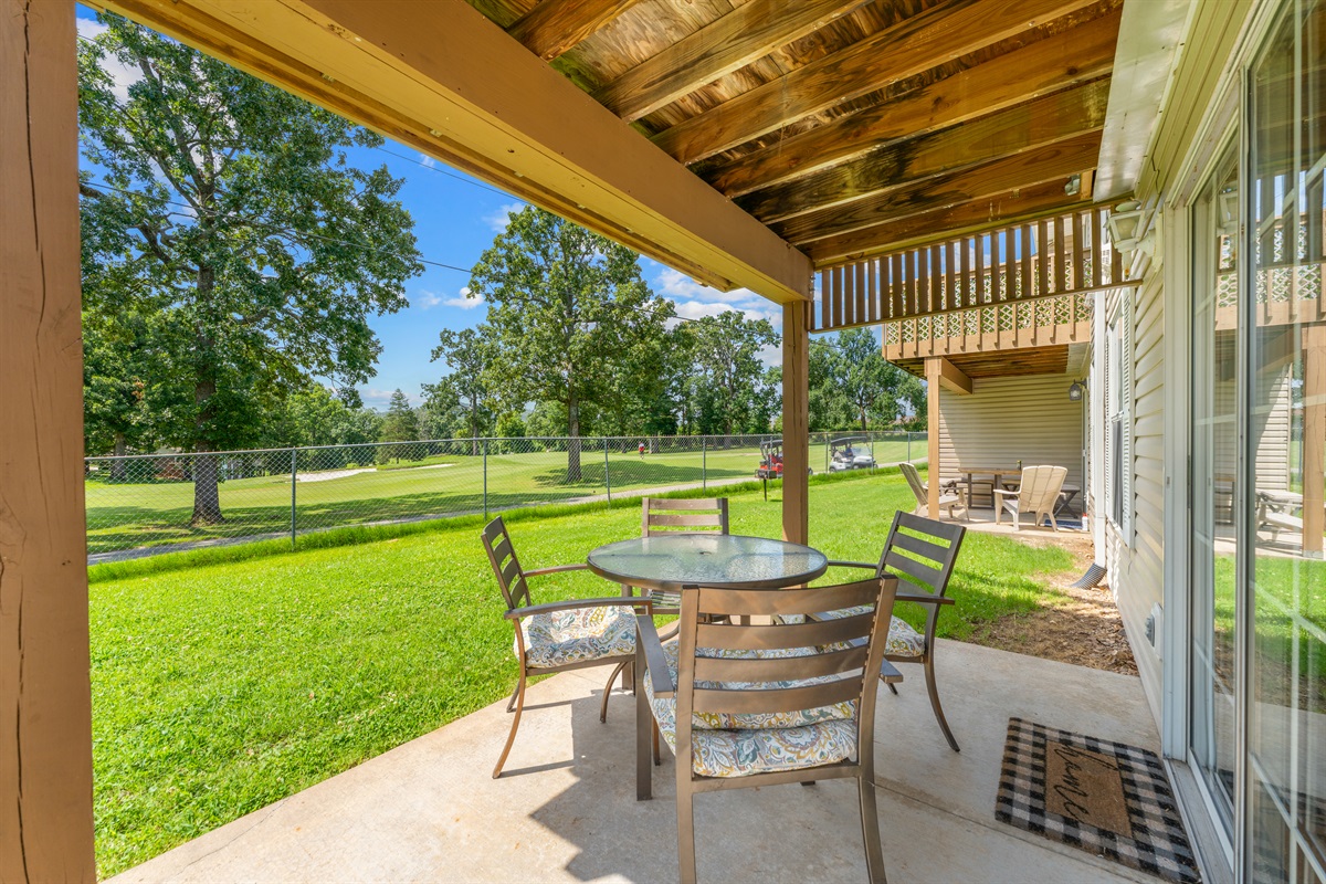 Covered patio with seating—enjoy your morning coffee with a view.