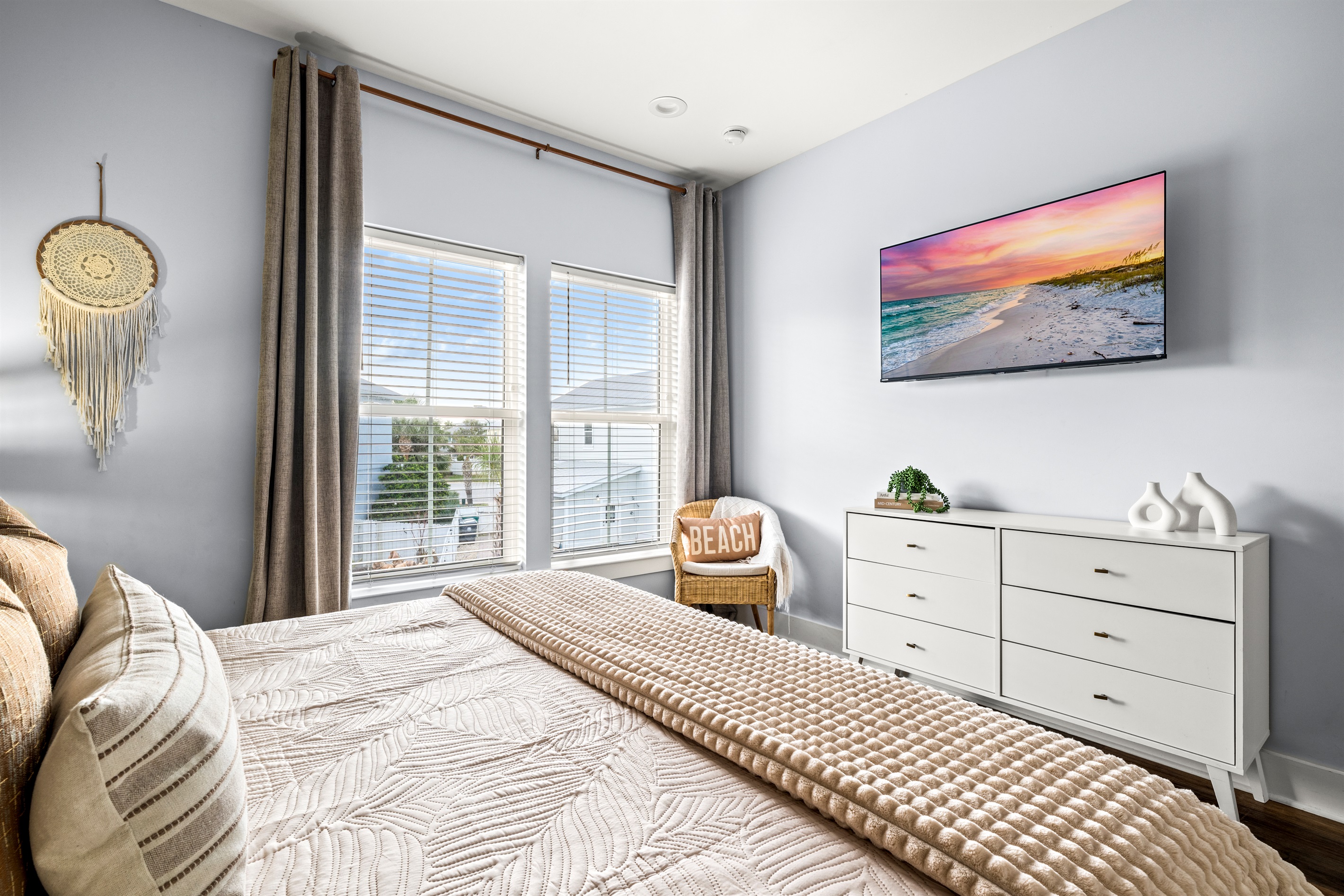 Sunlight, soft bedding, and relaxed coastal design create a peaceful place to start and end every beach day.