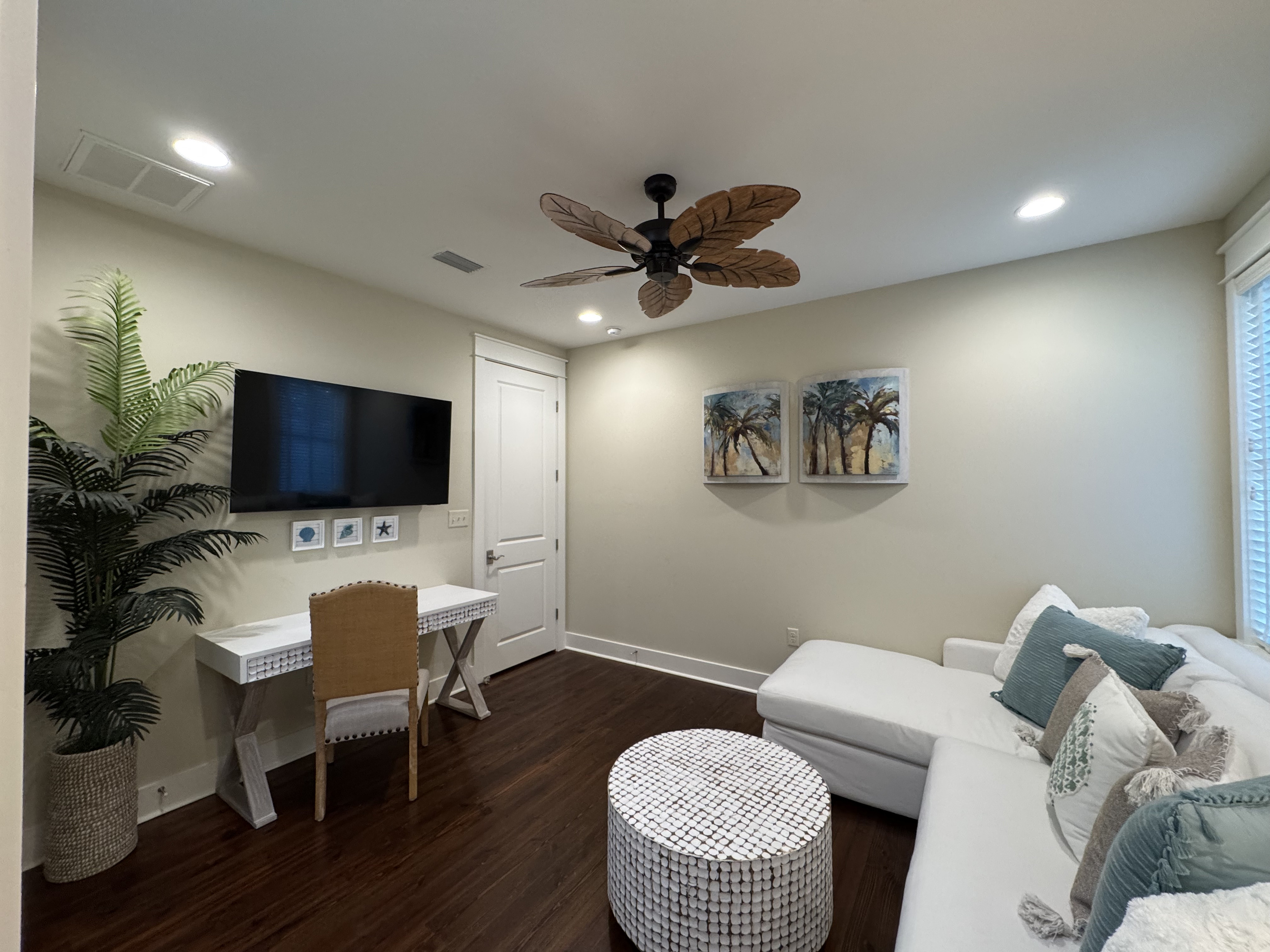 Flexible upstairs lounge with PlayStation, desk, yoga mat, and room for a Pack ’n Play.