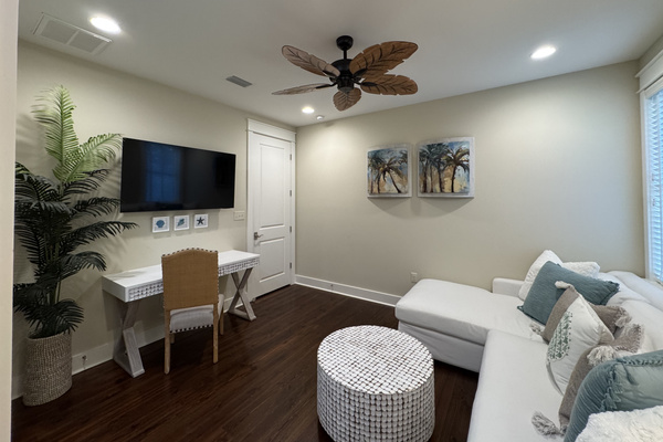 Flexible upstairs lounge with PlayStation, desk, yoga mat, and room for a Pack ’n Play.