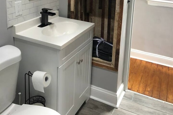 Reclaimed Lath panelling in bathroom closet.