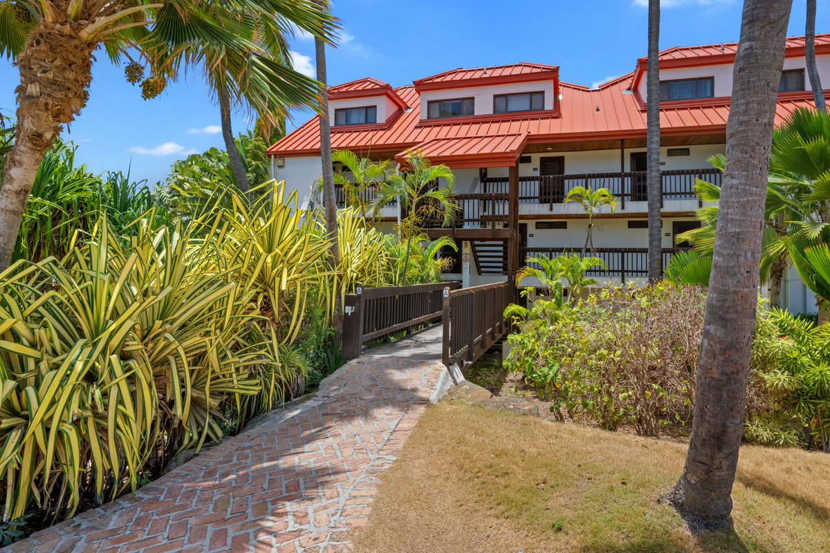 Beautifully maintained resort grounds surrounded by lush tropical landscaping.