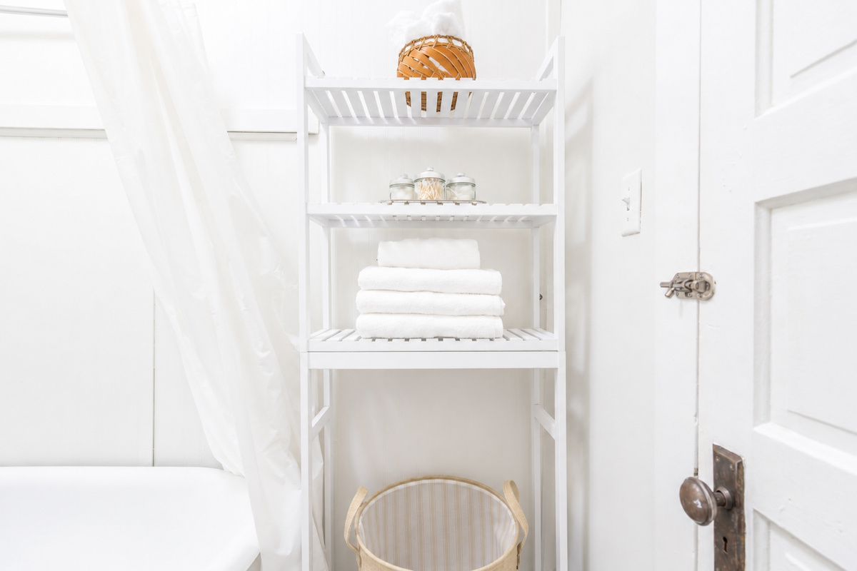 Bathroom essentials and fresh towels provided, plus a hamper to keep used linens tidy.