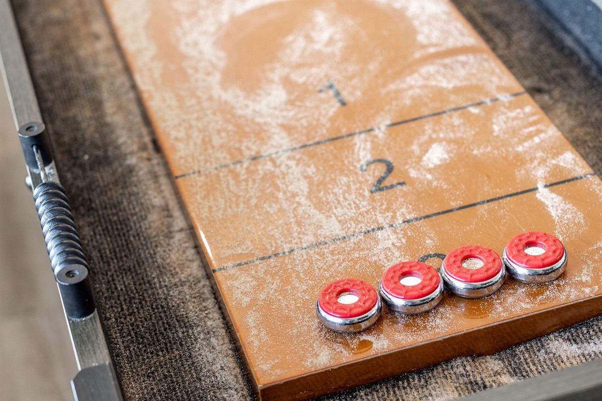 Challenge your friends to a shuffleboard game!