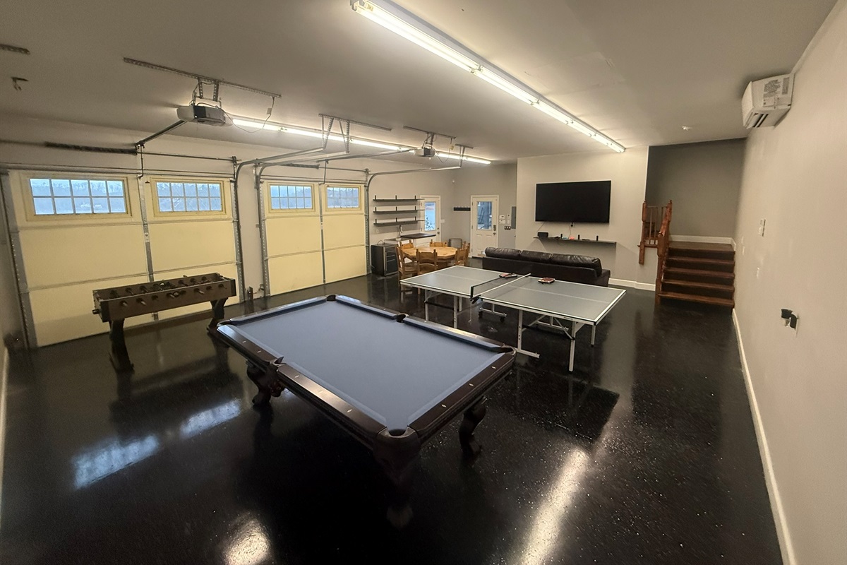 8ft pool table, ping pong foosball, nintendo2 games on 75 inch TV, game table