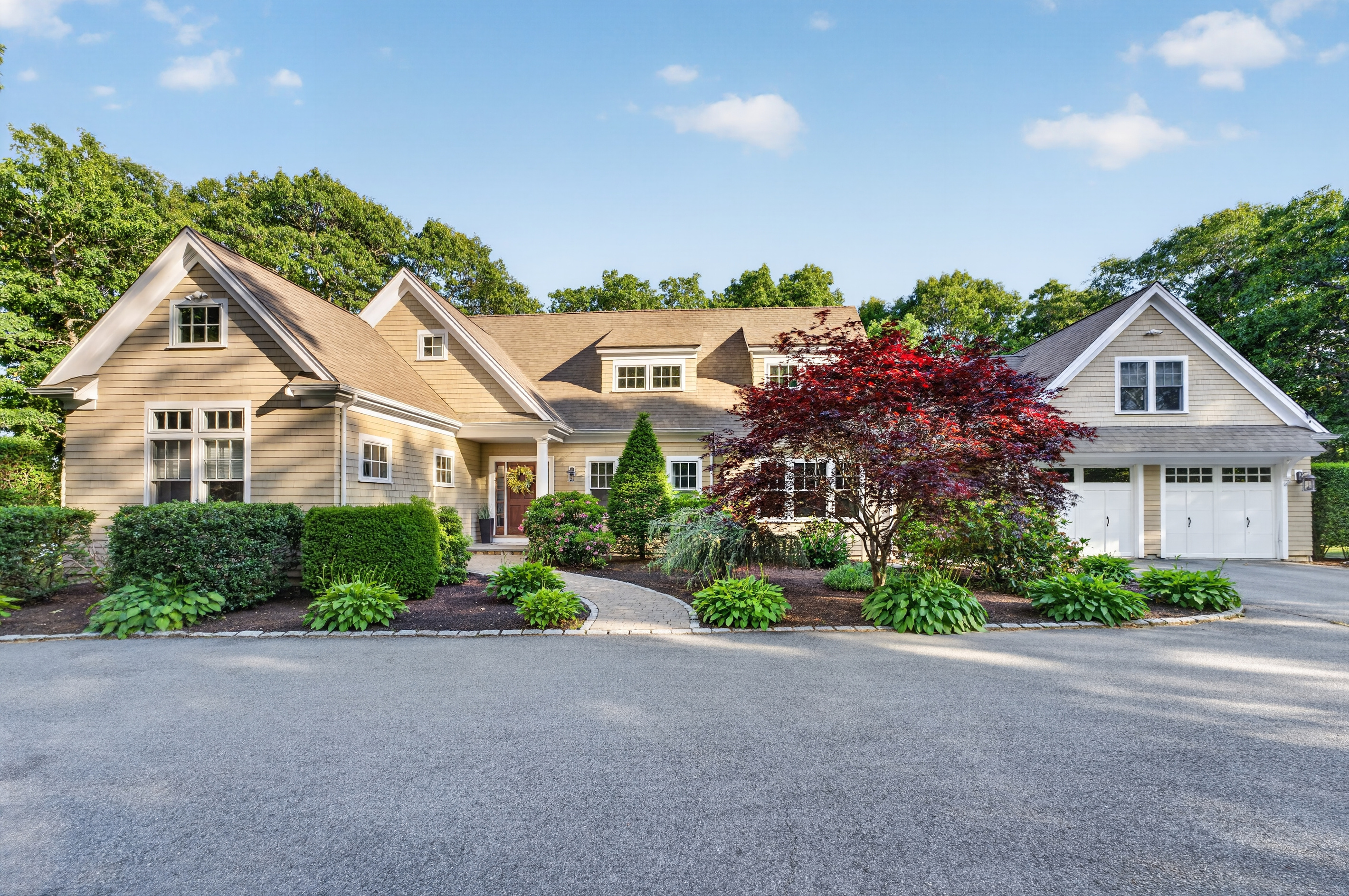 A full layout of lakeside living—grill, firepit, seating, and the water just steps away.