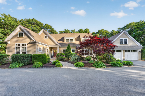 A full layout of lakeside living—grill, firepit, seating, and the water just steps away.