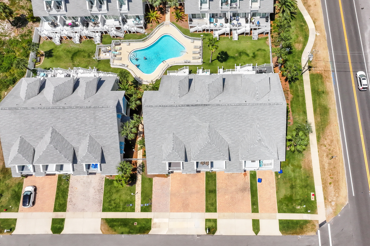 Experience resort living with a large community pool, spacious green spaces, and easy beach access