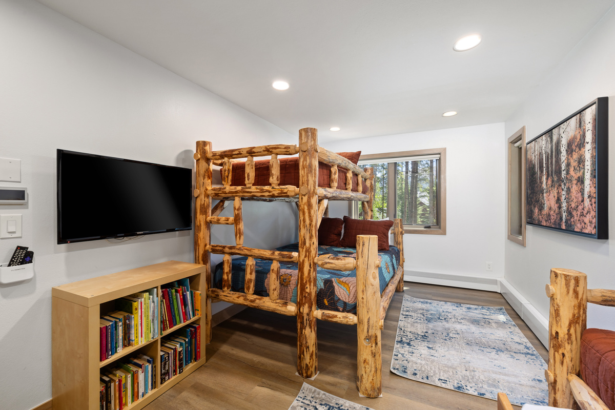 Bedroom #6 Bunk room – Sleeps 5 - one queen Bed, and three twin beds - Wall Mounted HDTV & Games, childproof plugs.