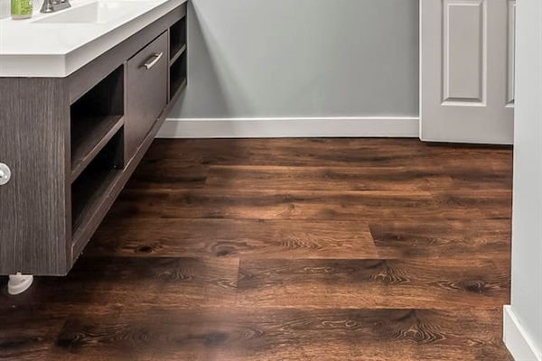 Spacious vanity area with contemporary lighting, large mirror, and plenty of room for daily routines.