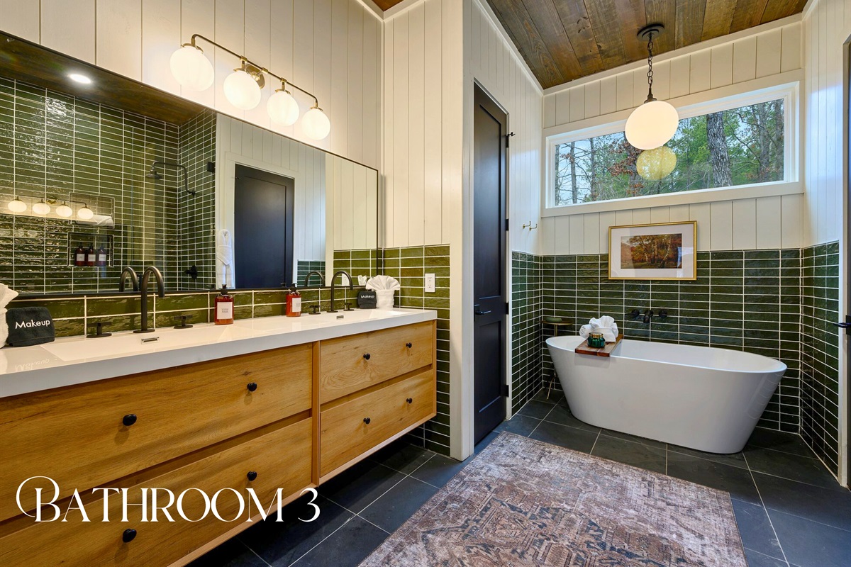 Natural textures and earthy green tones give this bathroom a spa-like feel that’s perfect for relaxing.