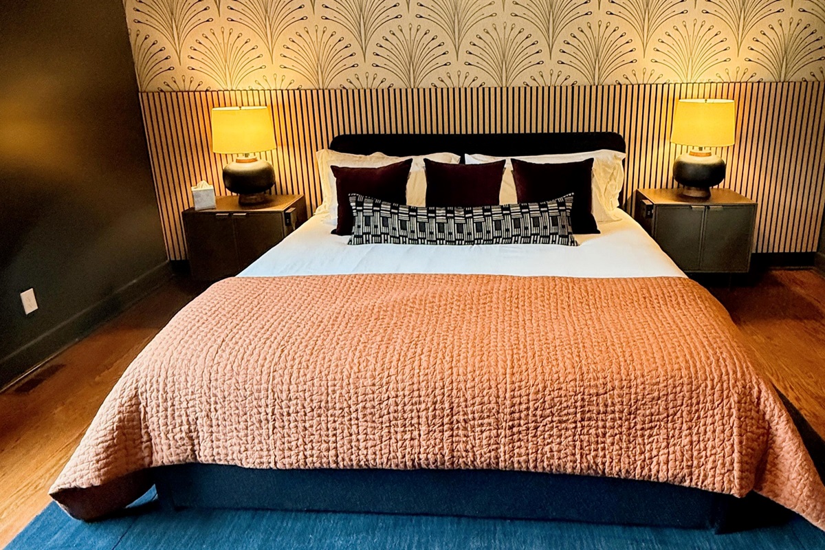 Spacious yet intimate — the primary suite’s warm tones and natural light create a tranquil retreat perfect for lingering mornings or quiet evenings together.