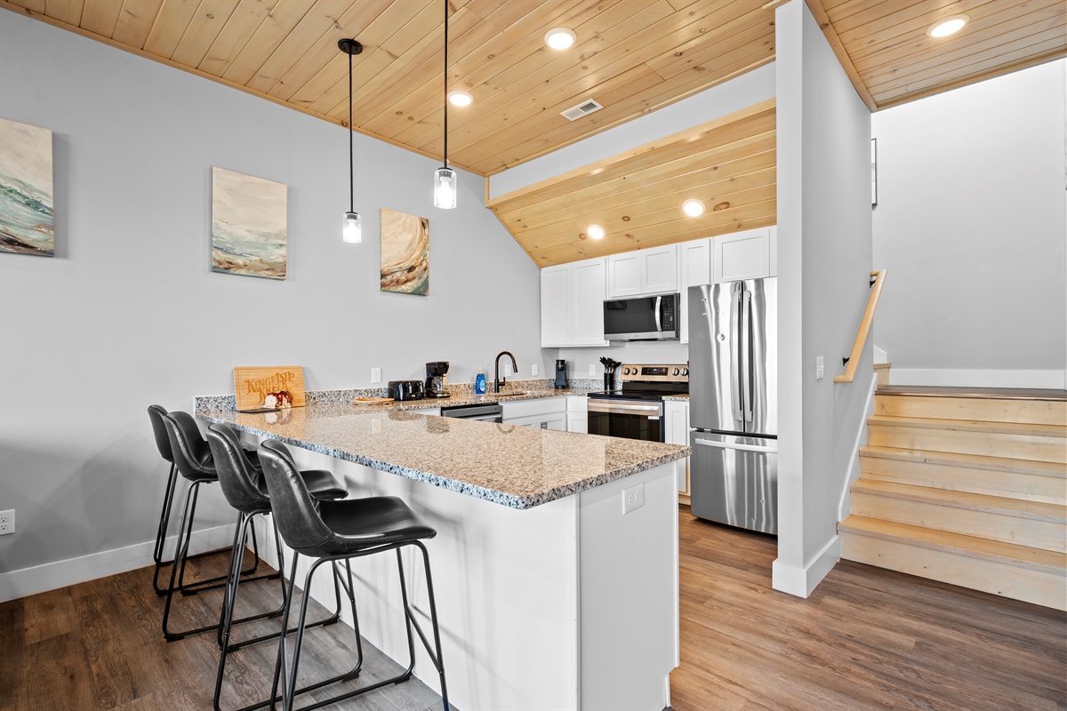 Kitchen island with bar seating—perfect for casual meals, coffee in the morning, or keeping the cook company while dinner is prepared.