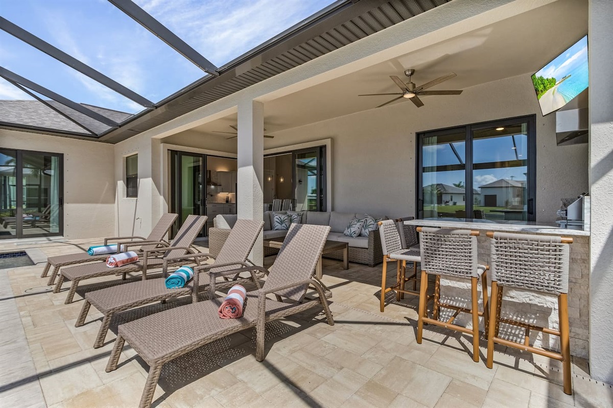 A vibrant outdoor entertainment area, ideal for BBQs, lounging, cocktails, and creating lasting memories!